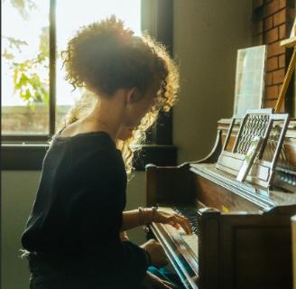 Nashville-Student-playing-piano image Student at piano exploring their gifts